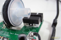Unidentified white-capped microswitch for scroll-click, takes more to actuate compared to the primaries.